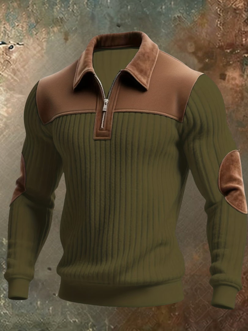 Olive green ribbed quarter-zip jumper with brown suede-look collar, yoke and elbow patches, displayed front-on against a weathered backdrop. 4