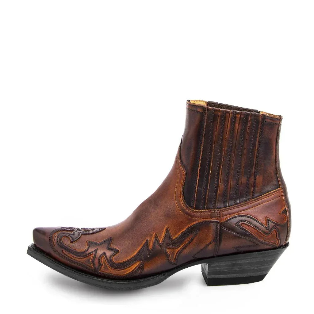 Side view of the same pointed-toe Western ankle boot in glossy brown leather with darker stitched overlays and a black stacked heel. 2