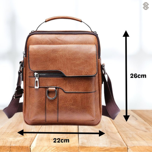 Front of the tan shoulder bag with arrows marking its dimensions, 26cm in height and 22cm in width. 12