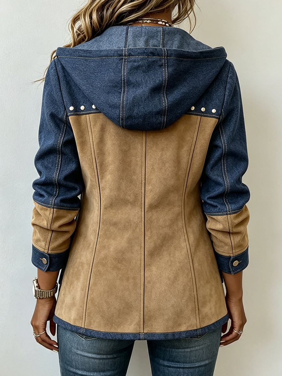Back view of the hooded jacket worn by a model, showing the tan suede-effect panel, blue denim hood and sleeves, and studs at the shoulders. 2