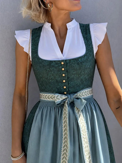 Close-up of the fitted bodice with gold-tone buttons, square neckline over a white blouse, smocked waist and patterned ribbon tied in a bow. 5