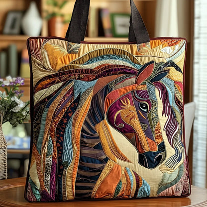 Quilted tote with a colourful patchwork horse design and dark straps, displayed on a wooden table in a home setting. 1