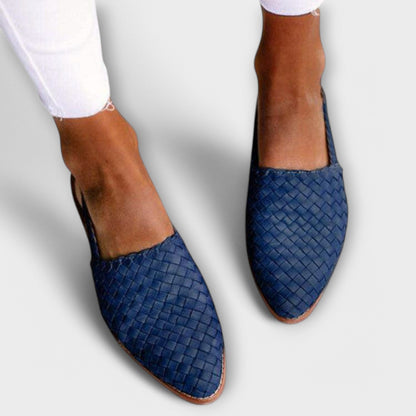 Navy blue woven pointed-toe slip-ons worn with white frayed jeans, seen from above. 4