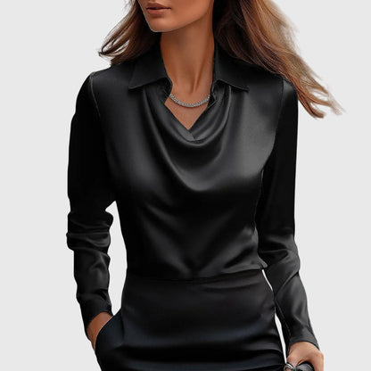 Model wears the plain black satin blouse with draped cowl neckline and collar, worn with a black skirt and slim necklace. 3
