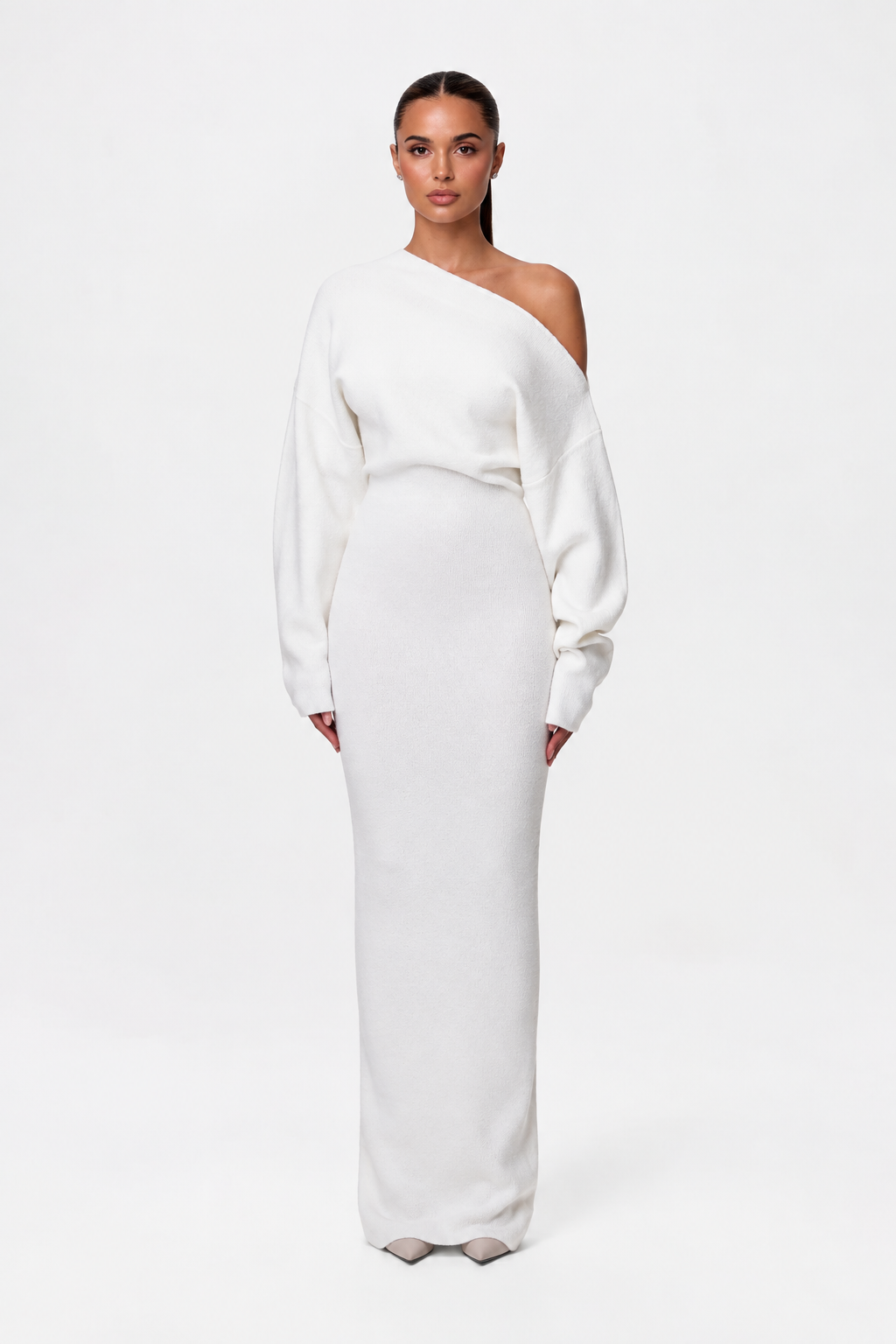 Model facing forward in the cream-white off-the-shoulder knit maxi dress with long sleeves and fitted skirt. 6