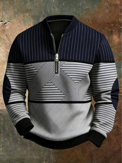 Navy and light grey half-zip jumper with pinstripe yoke, crossed stripe panel and black ribbed cuffs, shown against a textured backdrop. 1
