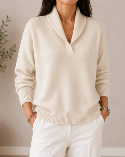 Front view of the jumper in cream on a model wearing white trousers, with ribbed cuffs and hem and a shawl collar. 6