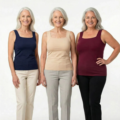 Three smiling women with grey hair stand together wearing square-neck sleeveless tops in navy, beige and burgundy with trousers. 9