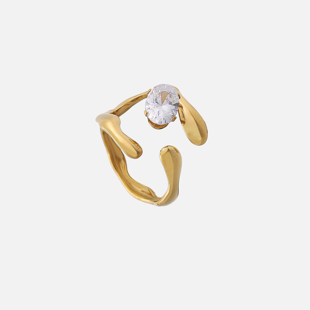 Gold-tone open ring with wavy, molten-looking band ends and a clear oval stone, shown from above on a plain light background. 1