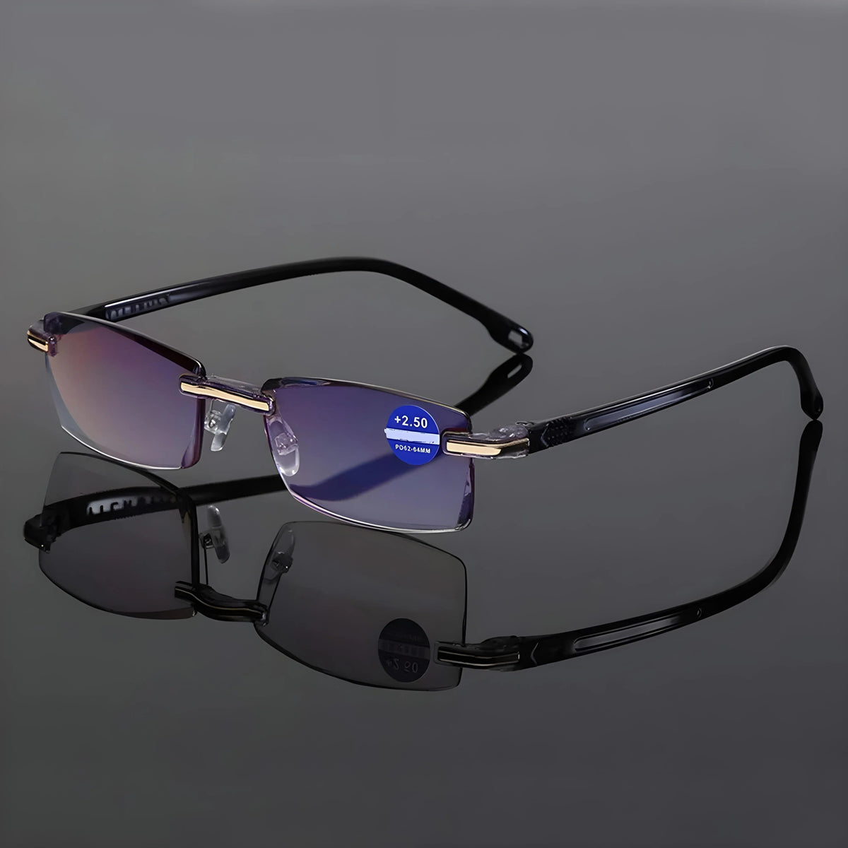 Rimless glasses with black arms standing open on a reflective grey surface, with a strength sticker on one lens. 6
