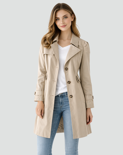 Front view of the beige version worn open over a white top and jeans, showing the notched lapels and cuff tabs. 2
