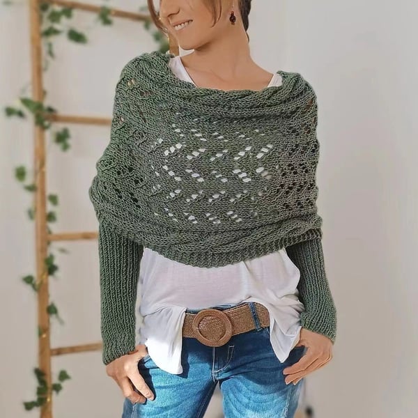 Sage-green wrap with lace panel and ribbed sleeves, worn with a white top and woven belt over jeans. 13