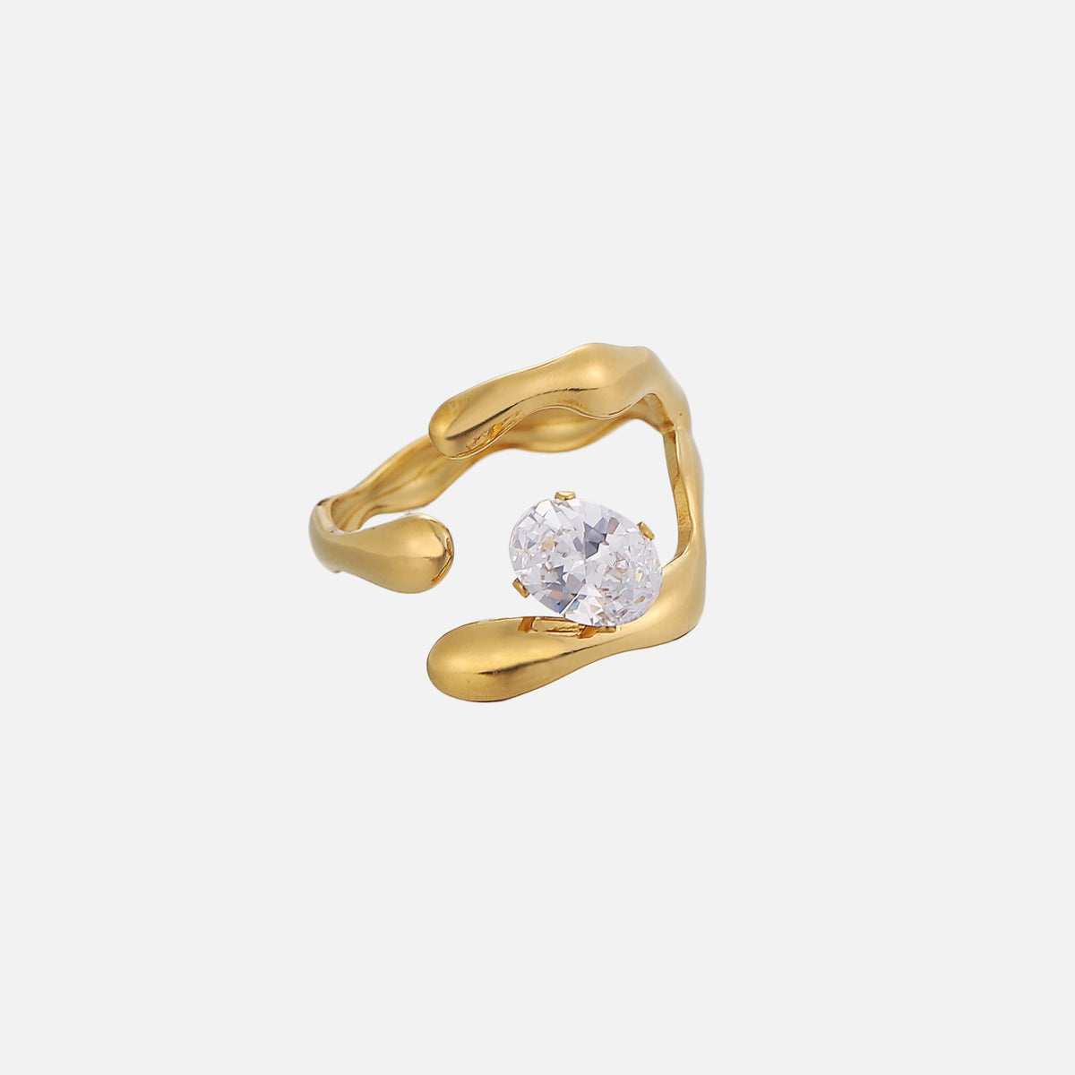 Same open gold-tone ring from a different angle, showing the clear oval stone held by small prongs between the rounded band ends. 2