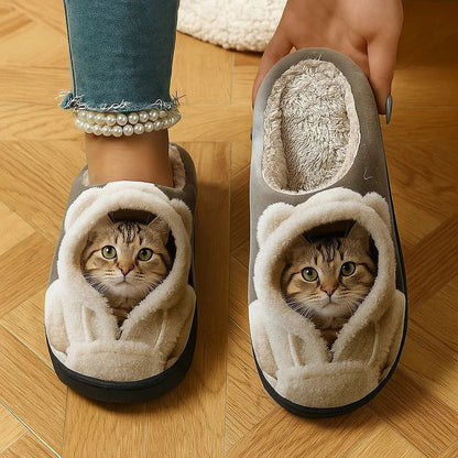 Front view of the slippers worn with pearl ankle bracelet while a hand lifts one to show its fluffy lining. 1