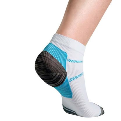 Rear three-quarter view of a white ankle sock worn on a bare foot, showing the blue ribbed heel panel and dark heel cup. 1