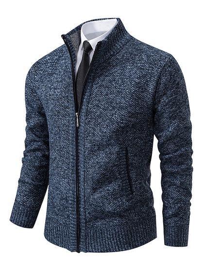 Blue mottled knit zip-up cardigan with ribbed collar, cuffs and hem, shown over a white shirt and dark tie. 4