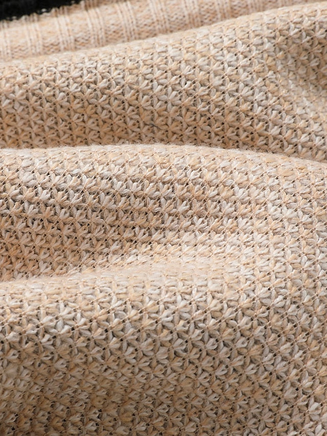 Close-up of the beige textured knit fabric, showing the small woven star-like stitch pattern in warm tones. 8