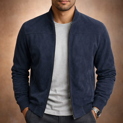Front view of the jacket in navy blue, worn unzipped over a grey t-shirt with a steel watch. 3