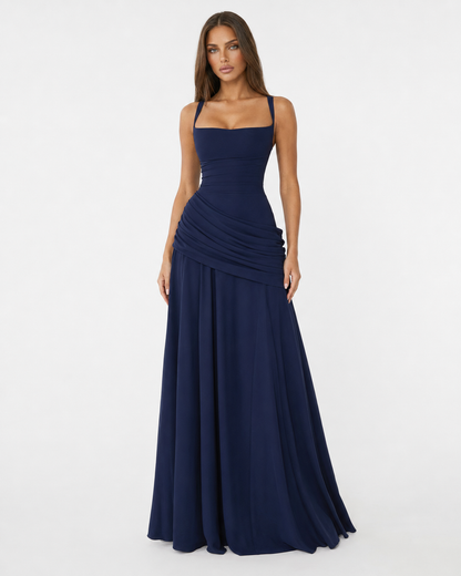 Front view of the navy dress with square neckline, wide straps, draped hip and full skirt. 15