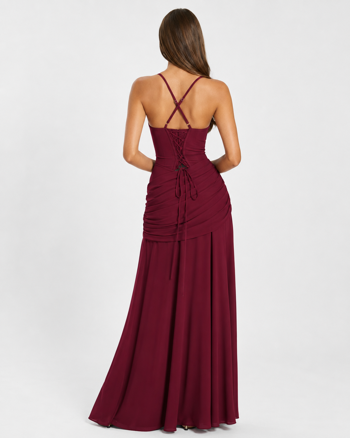 Back view of the burgundy dress with crossed straps, lace-up back and gathered hip drape. 11