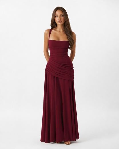 Full-length front view of the burgundy maxi dress, with wide straps, square neckline and diagonal gathered waist. 16