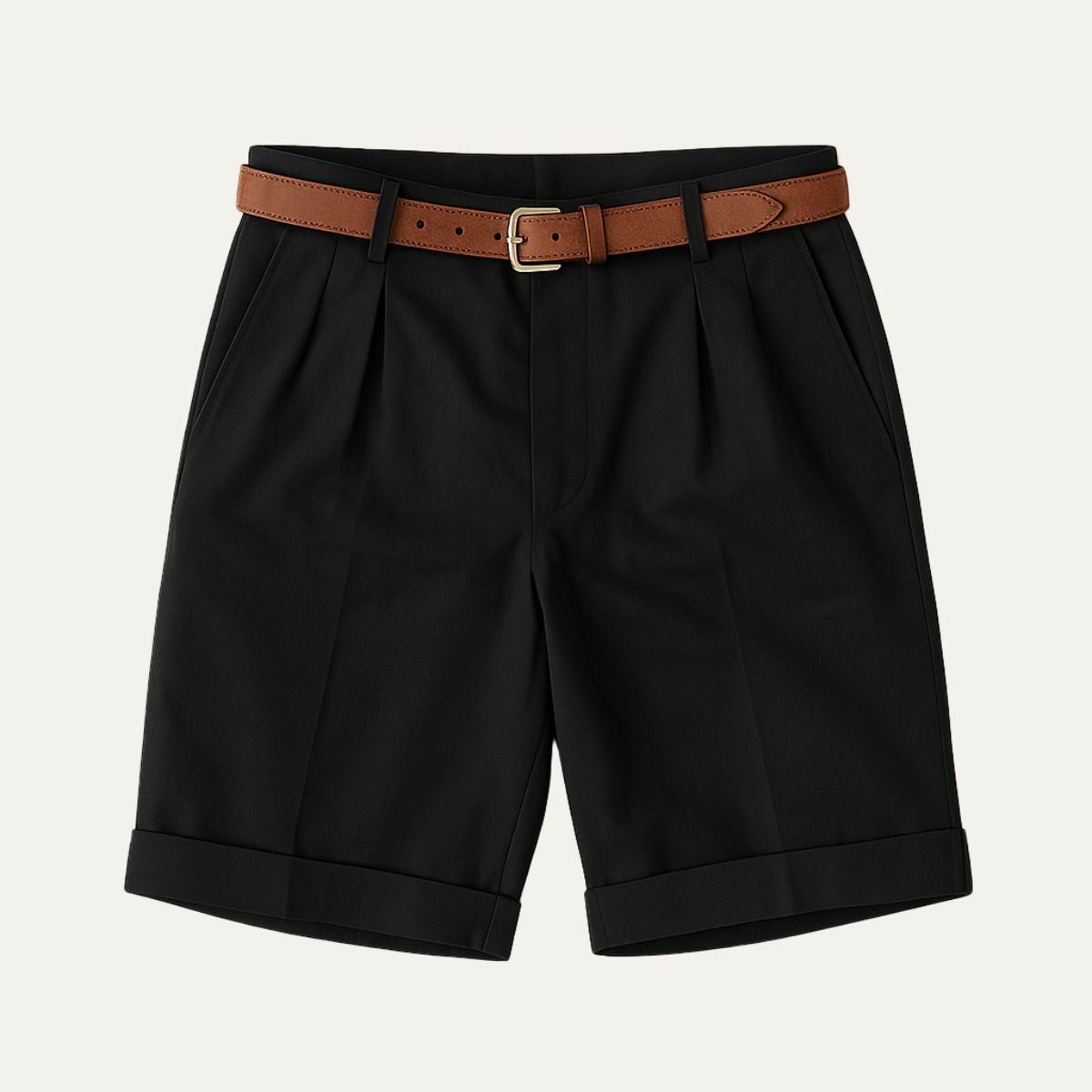 Black pleated shorts with turn-up hems, laid flat from the front with a tan leather belt and gold-toned buckle. 11