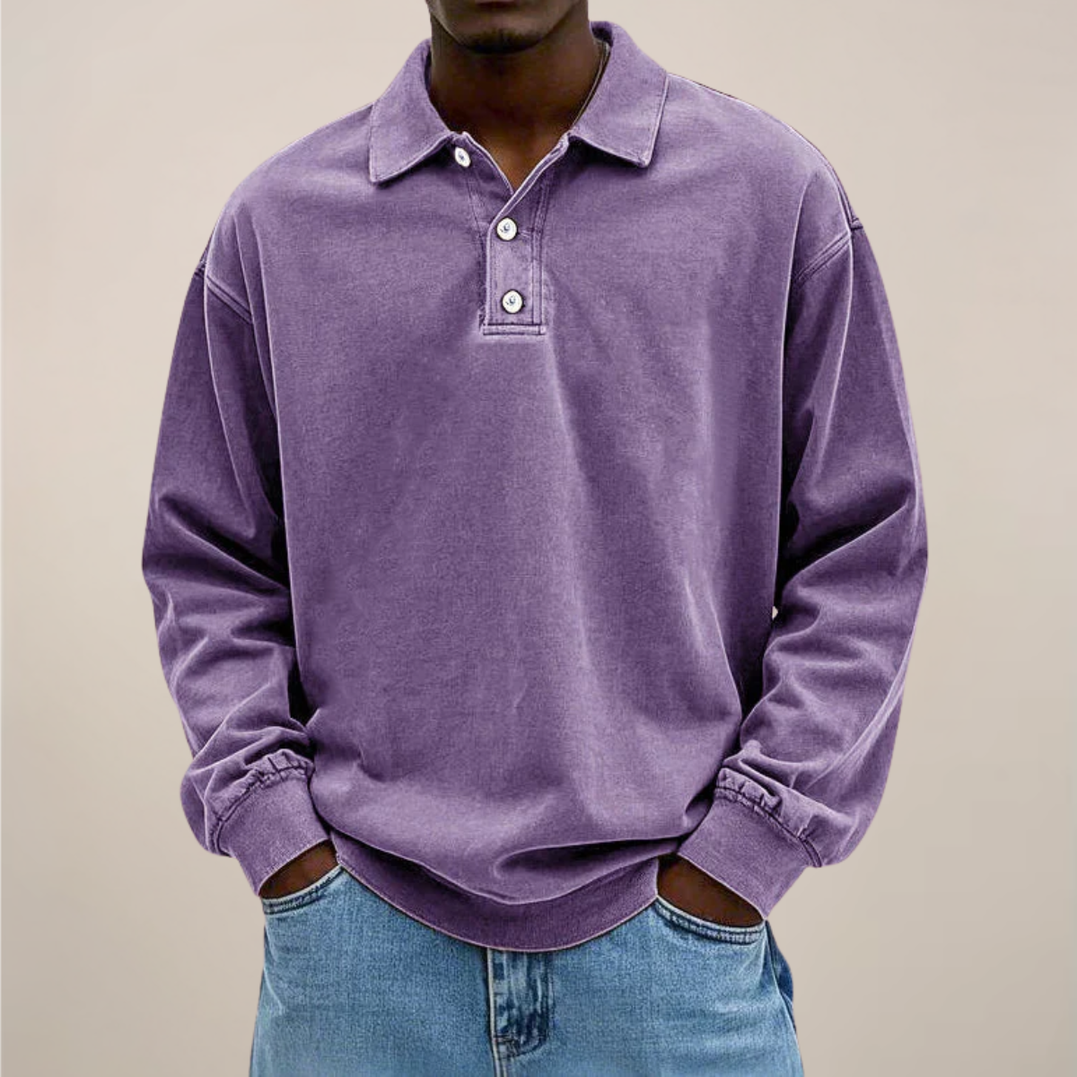 Front view of the relaxed polo in washed purple, worn with light blue jeans and a button placket at the collar. 4