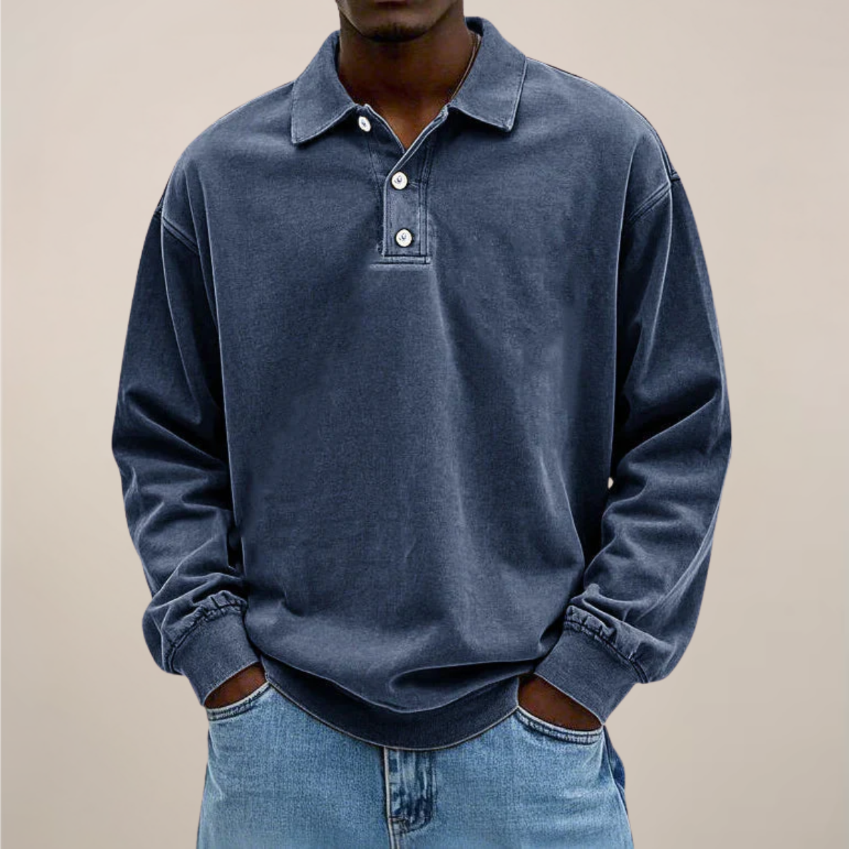 Model wearing the polo in washed dark slate blue, front view showing the collar, buttons and dropped shoulders. 5