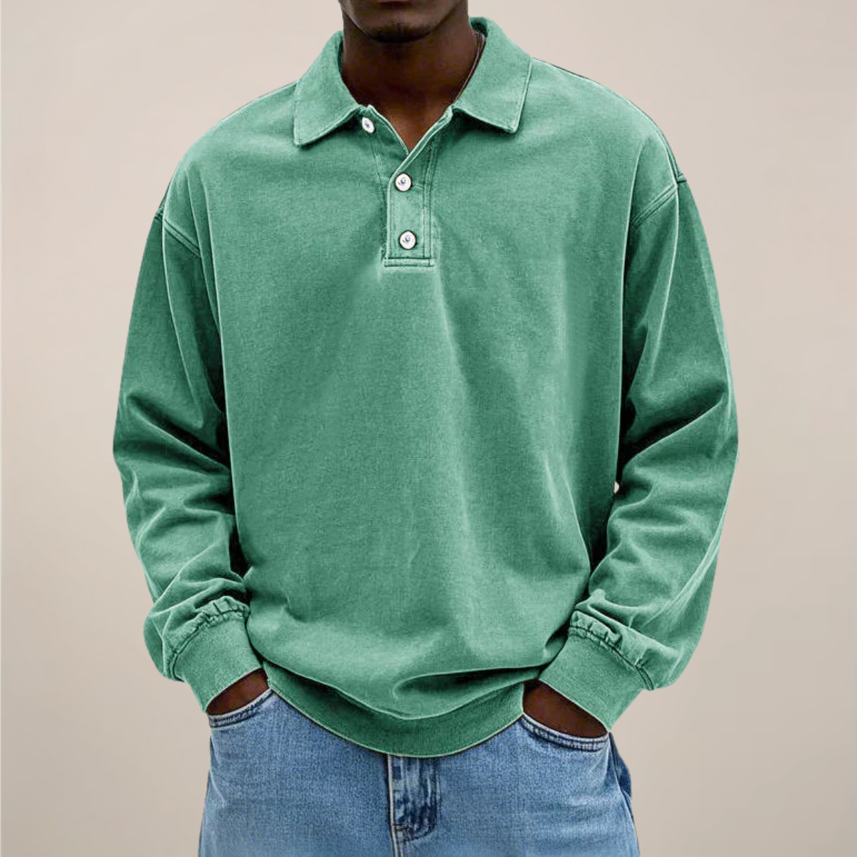 Model wearing the washed polo in soft mint green, front view, with buttoned placket and loose sleeves. 9