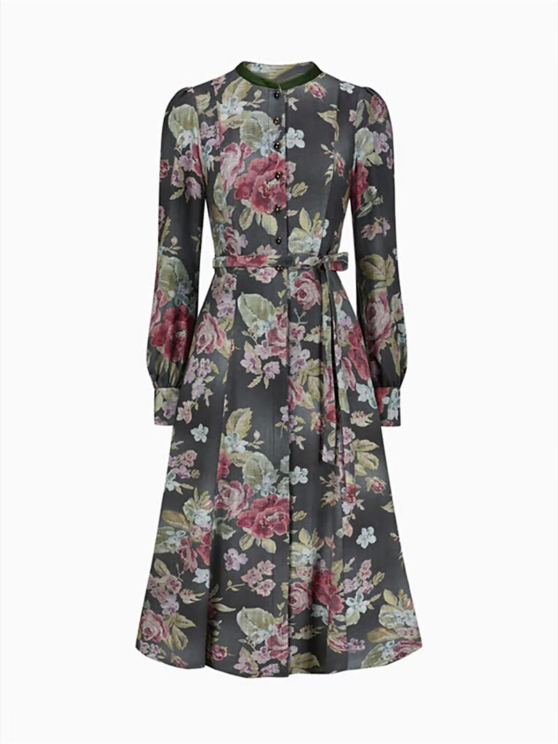 Front view of the floral dress without the apron, showing the full-length button front, thin waist tie and green collar. 6
