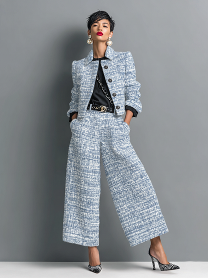Model wearing the matching cropped jacket and wide-leg trousers in a soft blue and white textured weave over a black top. 3