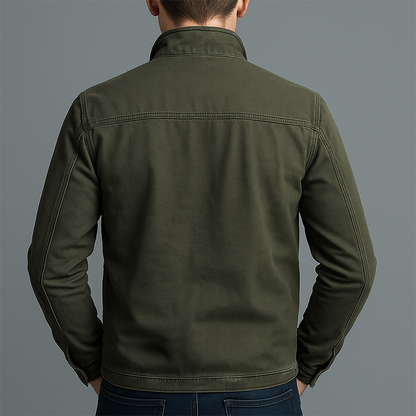 Back view of the olive green jacket on a model, showing the plain back panel, shoulder yoke seam and stitched hem. 3