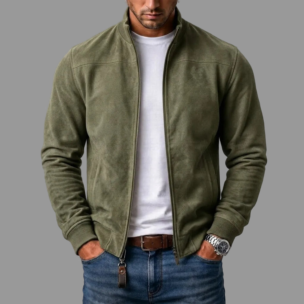 Olive green suede bomber with stand collar, worn open by a model with a white tee and blue jeans. 3
