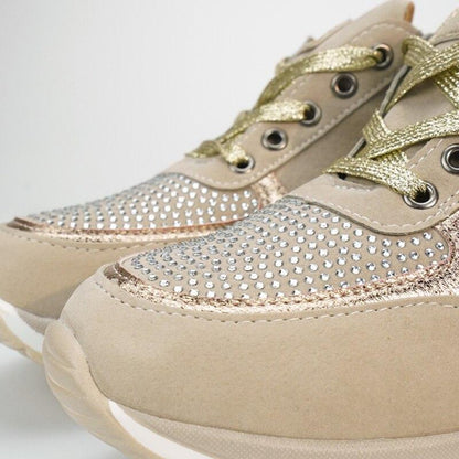 Close-up of the toe area of the beige trainers, showing the rhinestone-studded panel, metallic gold laces and rose-gold edging. 10