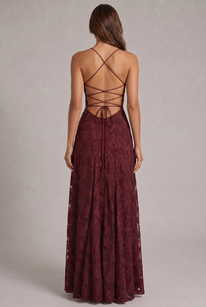 Back view of the burgundy maxi dress, showing the criss-cross lace-up open back, tie closure and zip. 3