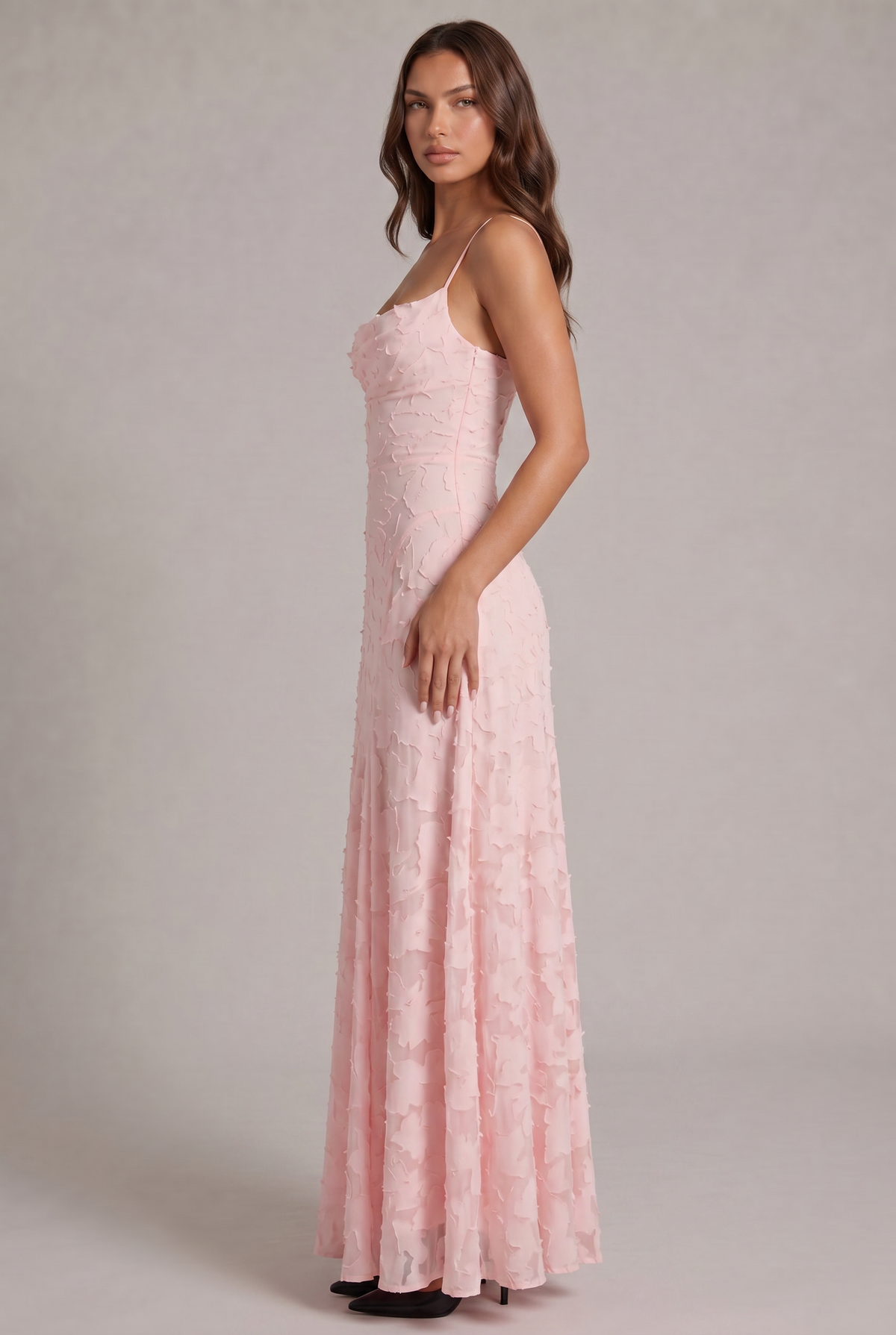 Side view of the pale pink maxi dress on a model, showing the fitted bodice and long flowing skirt. 8