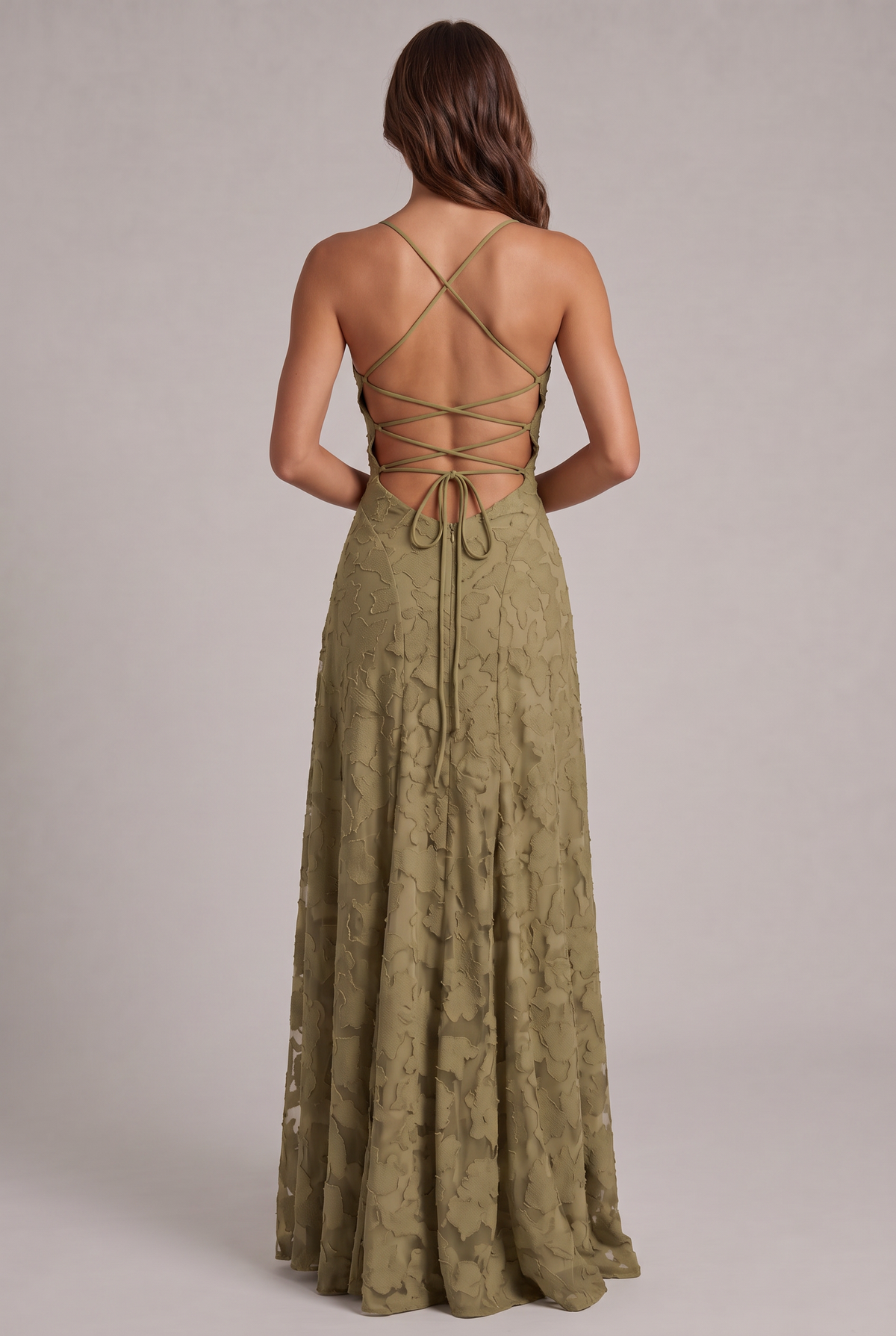 Back view of the olive green maxi dress, showing the criss-cross lace-up open back, tie closure and zip. 15