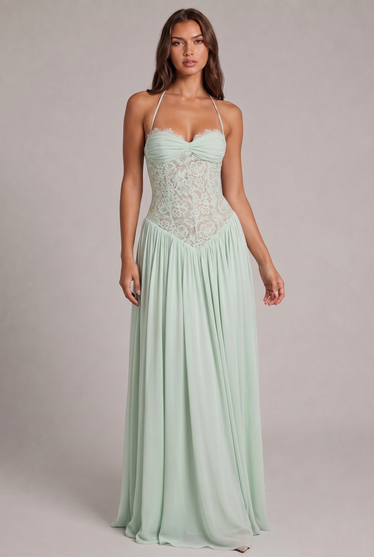 Model facing the camera in the pale mint green maxi dress, showing the sheer lace corset bodice and flowing chiffon skirt. 9