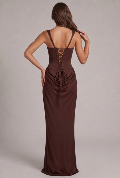 Back view of the chocolate brown dress, showing the corset lace-up back, adjustable straps and the long ties over the draped skirt. 4