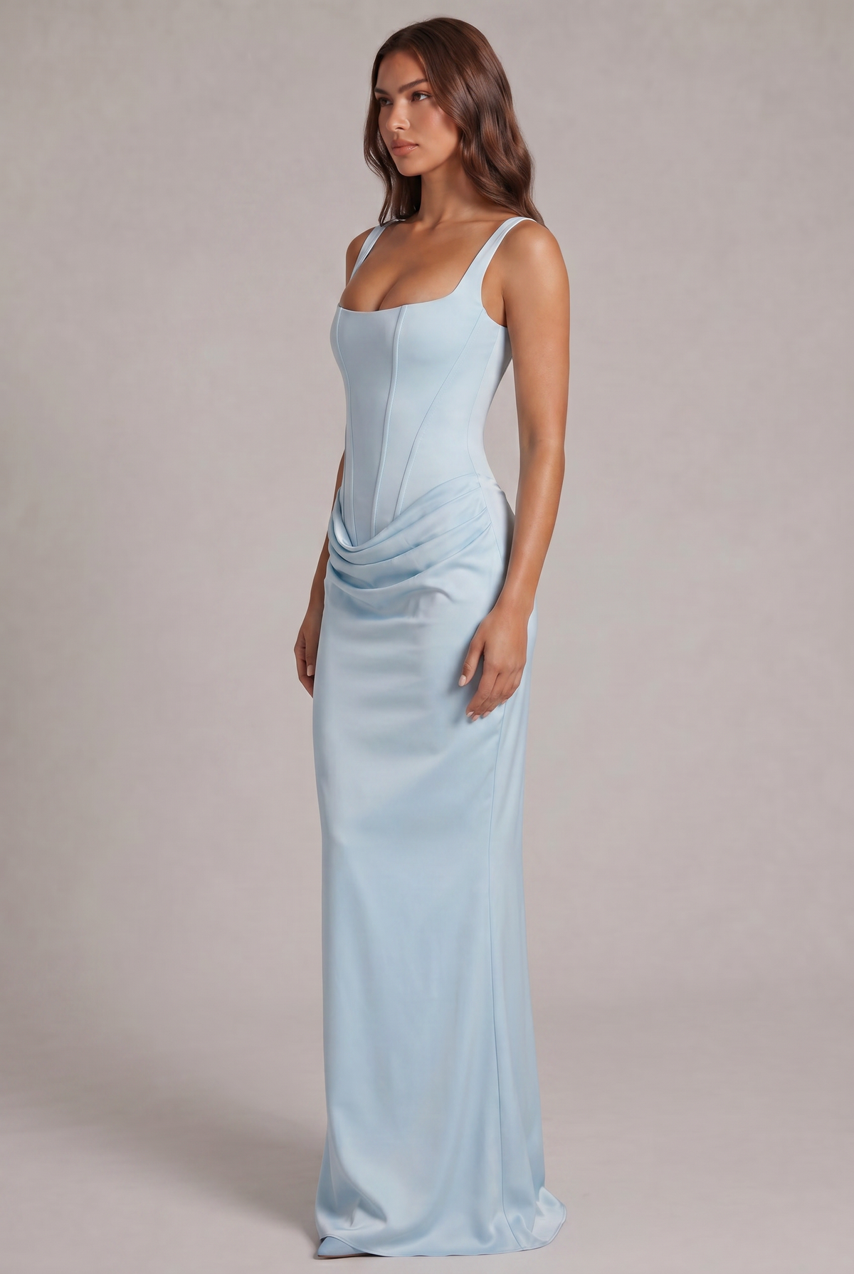 Side view of the pale blue maxi dress, showing the corset bodice, the draped hip and the long, fitted skirt. 15