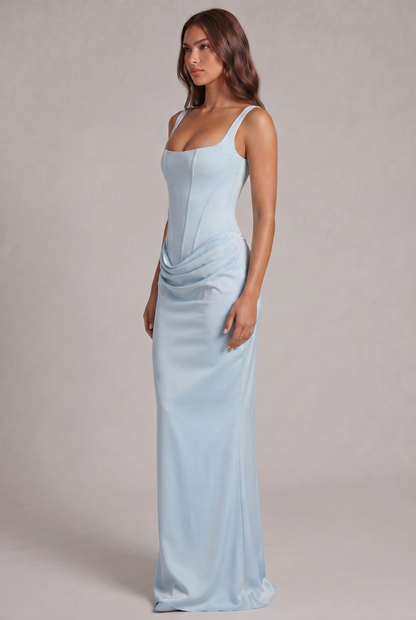 Side view of the pale blue maxi dress, showing the corset bodice, the draped hip and the long, fitted skirt. 15