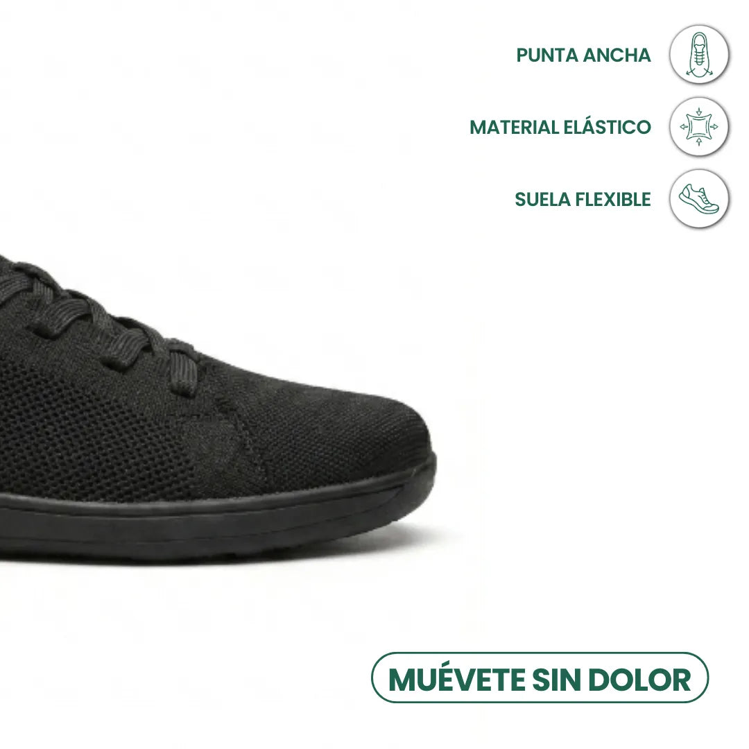Close-up of the wide toe of a black trainer beside a Spanish infographic on toe room, stretch fabric and flexible sole. 14