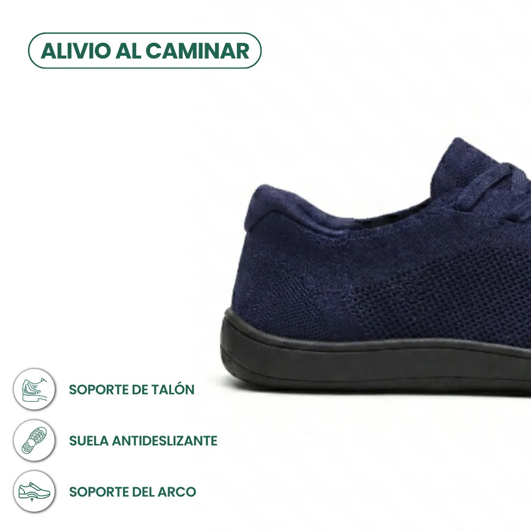 Close-up of the heel and side of a navy knit trainer with black sole, with small feature icons beneath. 22