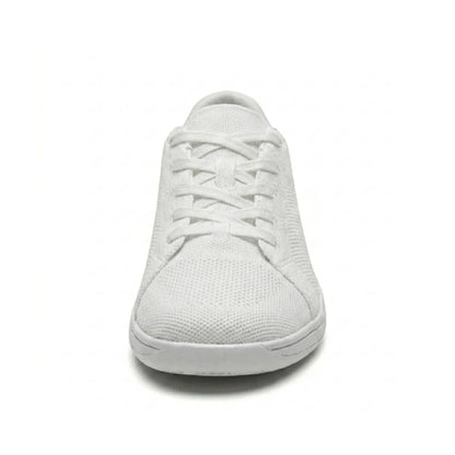 Front view of a white mesh trainer showing the broad rounded toe, criss-cross laces and flat sole. 44