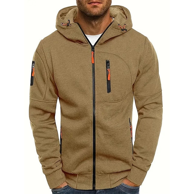 Model wearing the khaki-brown zip-up hoodie from the front, with orange zip pulls and black zip tape. 4