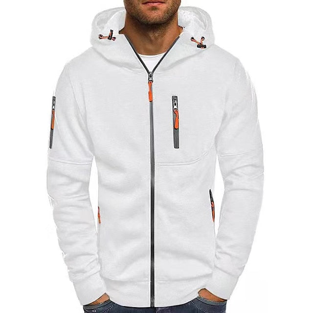 Man wearing the white zip-up hoodie from the front, with orange zip pulls, a chest zip pocket and a sleeve pocket. 1