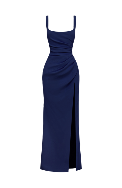 Navy maxi dress shown alone on a white background, with square neckline, ruched waist and side slit. 16