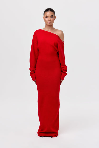 Model facing the camera in a red off-the-shoulder knit maxi dress with long sleeves and a fitted floor-length skirt. 21