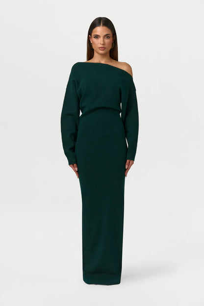 Model facing forward in the dark green off-the-shoulder knit maxi dress with long sleeves. 12