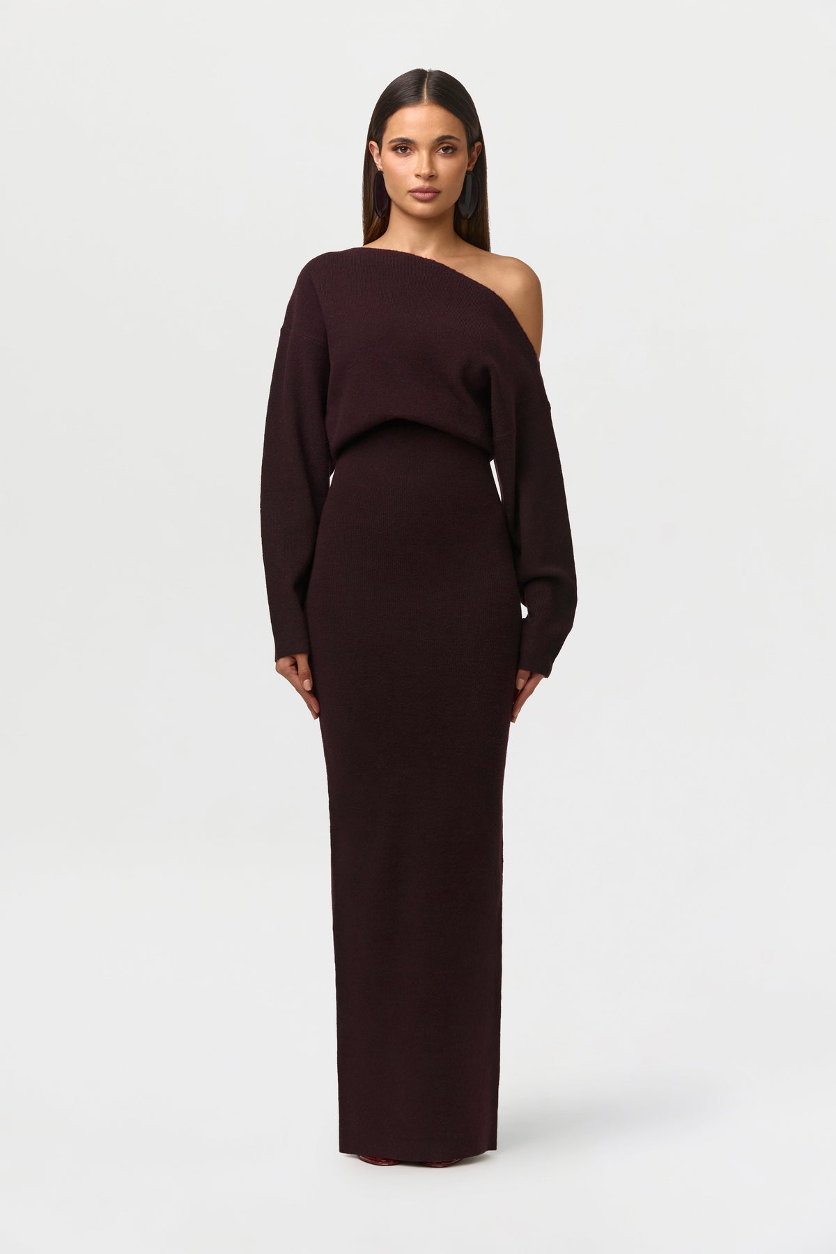 Model facing forward in the deep burgundy-brown off-the-shoulder knit maxi dress with long sleeves. 18